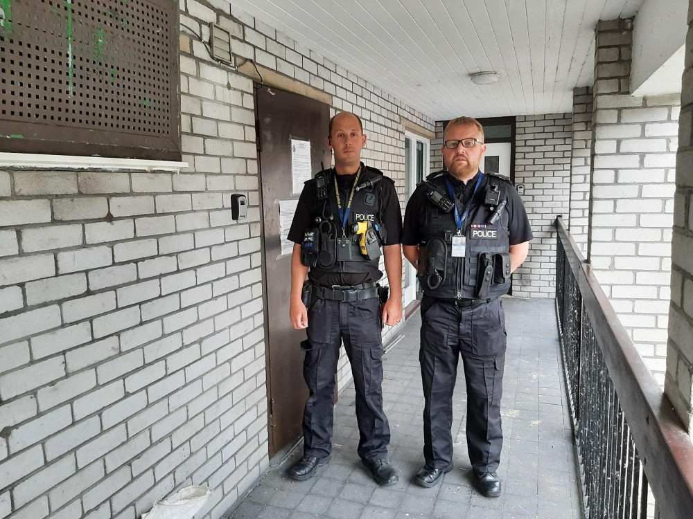 Street Neighbourhood Policing Team PC James Higgins (left) and Sergeant Simon Lancey (right) outside the address (A&S Police) 