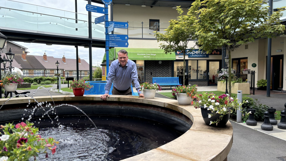 WCS Care’s Chief Executive, Ed Russell OBE, in the plaza at Woodside Care Village, Warwick (image via WCS Care)