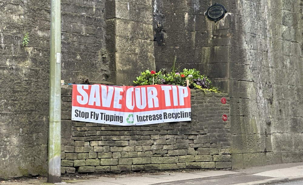 A 'SAVE OUR TIP' sign in Bollington. The town faces a future without their household waste recycling centre. (Image - Macclesfield Nub News)