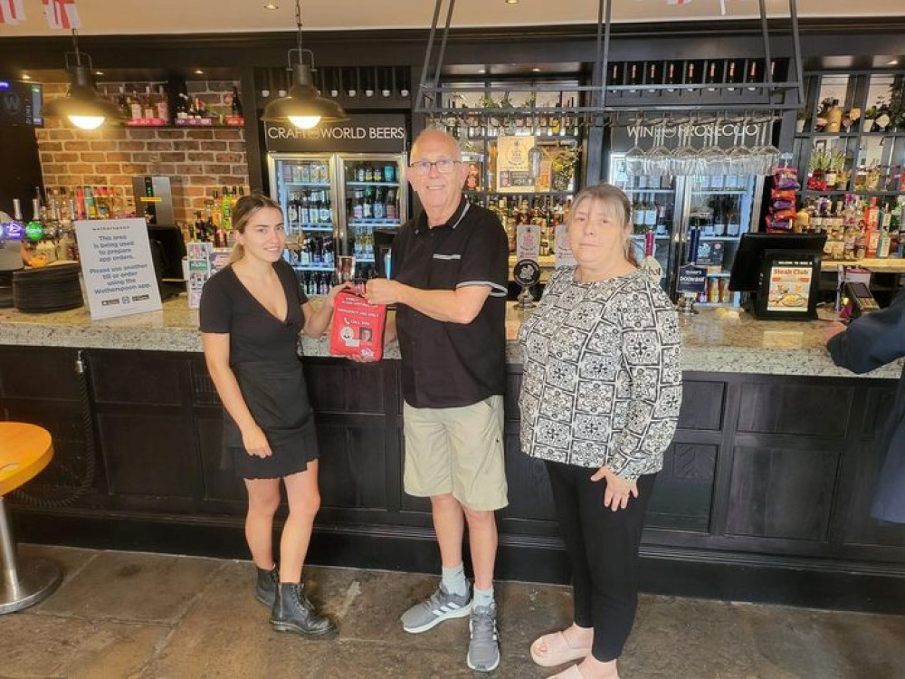 Julie Taylor alongside Tony of the St Peter's Freemasons Maldon, handing over a lifesaving bleed bag in Wetherspoons Maldon. (Photo: The Liam Taylor Legacy) 