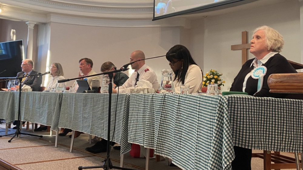 The table of candidates at the hustings event yesterday, From the left: Simon Burwood for the Liberal Democrats, Isobel Doubleday for the Green Party, John Whittingdale for the Conservatives, Onike Gollo for the Labour Party, and Pamela Walford for Reform UK. (Photo: Chloe Brewster)