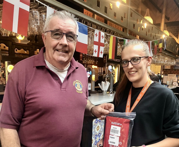 Paul Burtenshaw presents a bleed kit to Emily from the Wetherspoon Shoulder of Mutton pub in Ashby. Photos: Supplied