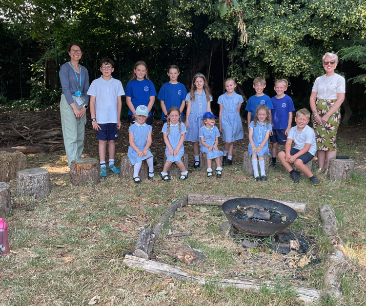 Youngsters and staff at the school garden.