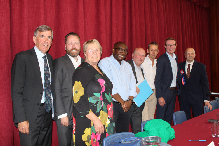 Candidates left to right: David Rutley, Neil Christian, Amanda Iremonger. Fourth from left is Manny Botwe, who is not a candidate, and is the headteacher of Tytherington School. Stephen Broadhurst, Christopher Wellavize, Tim Roca, Dickie Fletcher.