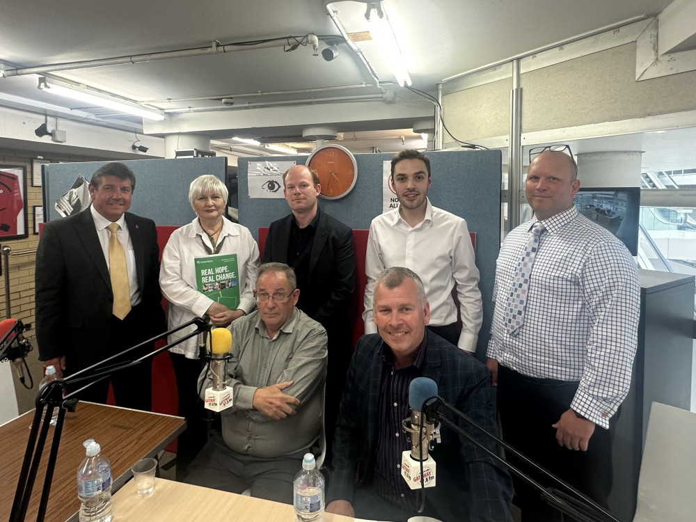 Candidates at the Gateway hustings with presenter Johnny Jenkins (second from right, standing). 