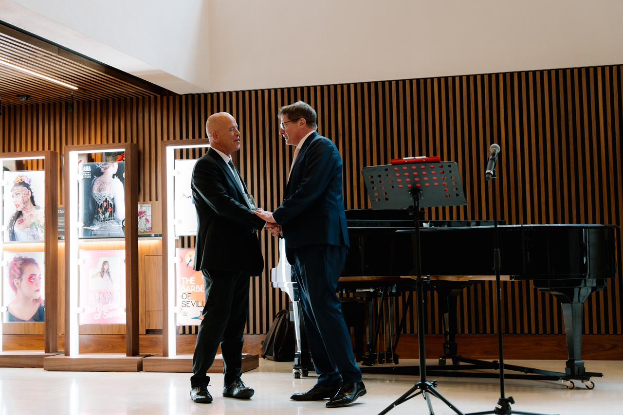 Neil Moore receives his award from Alex Beard CBE, CEO of the Royal Opera House. 