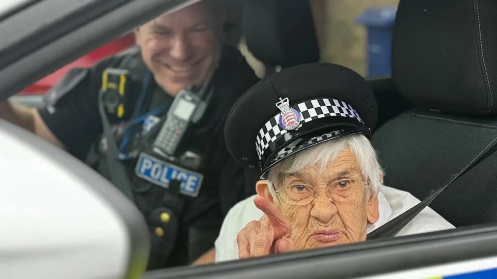 Happy times: The smiling face of PC Neil Brand helped make Corringham's resident Gwen Lewis's 100th birthday extra special. 