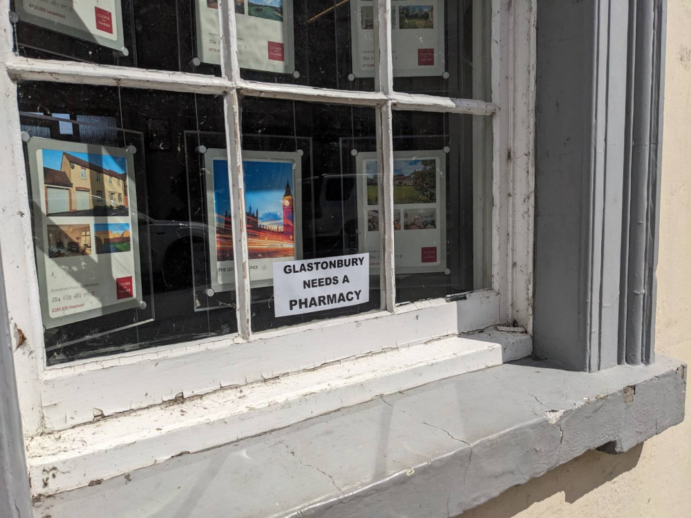 A sign supporting the pharmacy application in a Glastonbury business window (LL) 