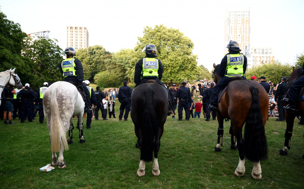 Police in Bristol on Sunday, 4 August as protest turn violent (credit: SWNS).