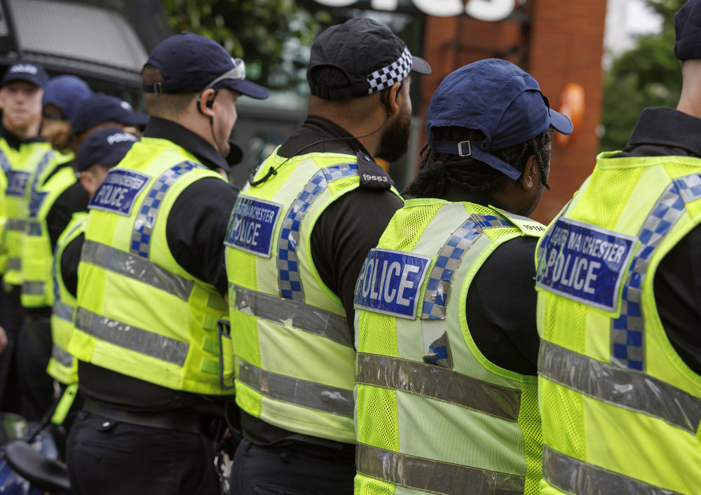 Greater Manchester Police deal with rioting in central Manchester - Cheadle in Stockport is understood to have a 'credible threat' of riots (Image - GMP)