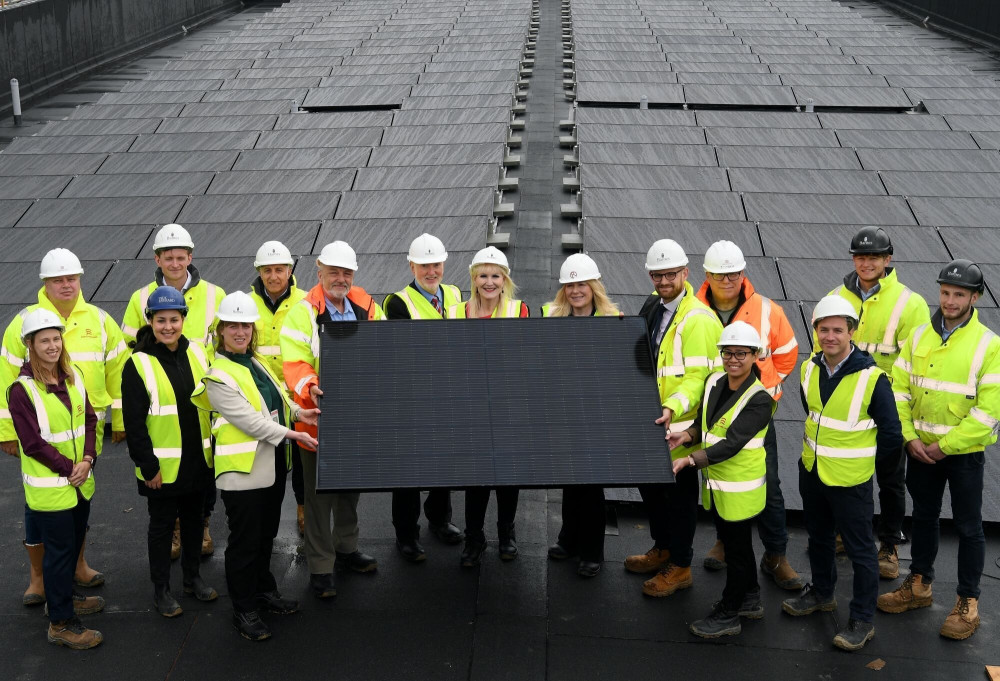 Dignitaries and event attendees at the topping out ceremony.