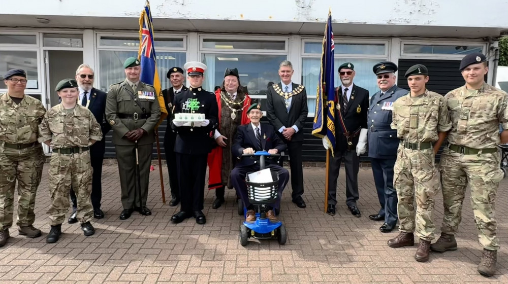 Ron Baker alongside MDC Chairman Kevin Lagan, Mayor Andrew Lay, and local Armed Forces Veterans and Sea Cadets. (Photo: Royal British Legion)