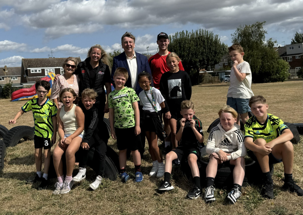 Maldon MP Sir John is pictured with organiser, Holly Fry, and Coach, Danny, with some of the children attending at Heybridge Primary. (Photo: John Whittingdale)