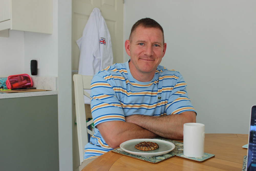 Dan Hunter, pictured with a brown butter chocolate chip cookie, with almond praline and vanilla caramel. (Image - Macclesfield Nub News)