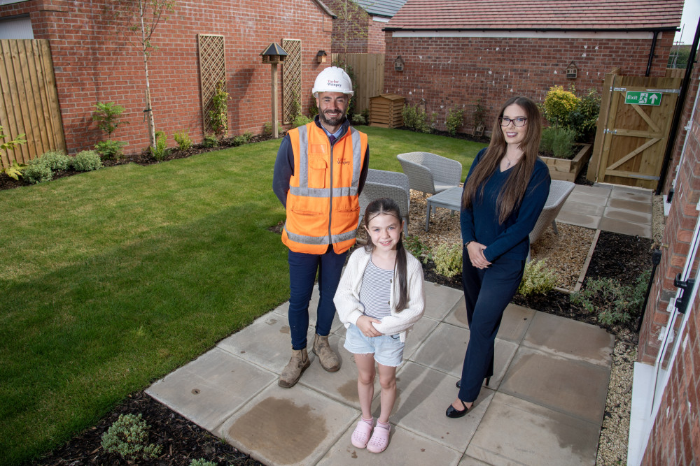 Ayla-Mae, Garden Design Winner with Ellie Coath, Taylor Wimpey Sales Executive, and Nathan Rose, Taylor Wimpey Site Manager. Photo: Supplied