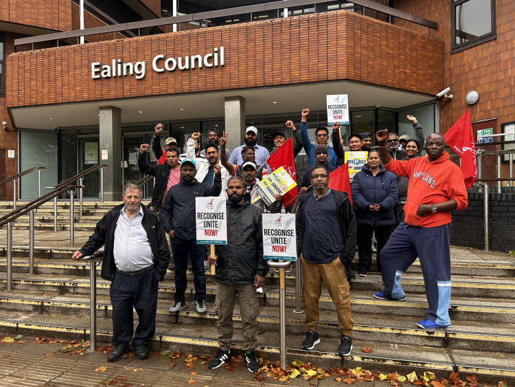 Striking traffic wardens stand together outside Ealing Council (credit: Philip James Lynch/LDRS).