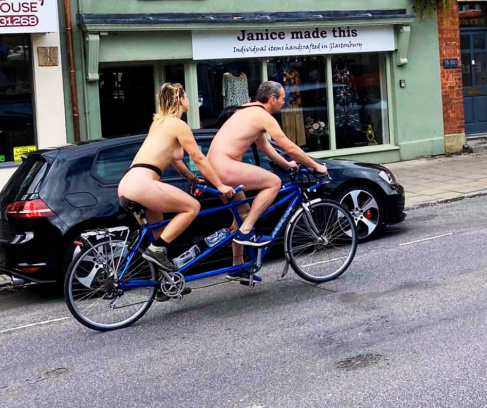 Neil Cox, 36, from Nantwich, was seen biking naked with his partner, J Antic, through Glastonbury on the way to Cornwall (Photo: Facebook/Richard Kay).