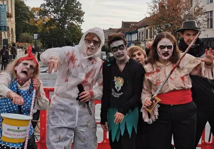 Participants in their best zombie costumes during the Glastonbury Zombie Walk, supporting Children’s World charity. (Photo: Children's World) 