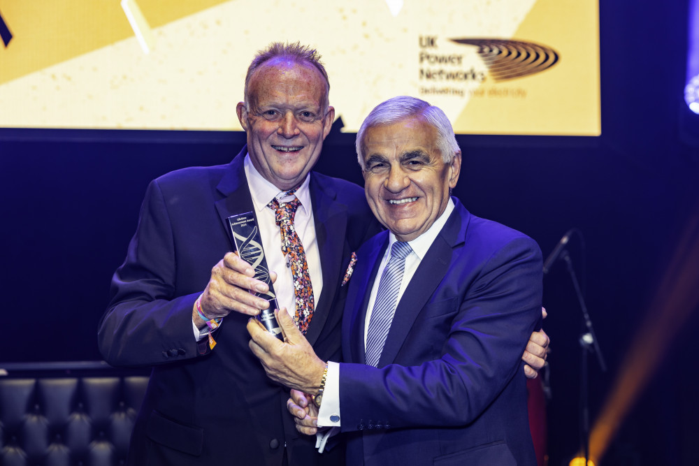 UK Power Networks training specialist, Lee Perkins from Tolworth, celebrates a lifetime achievement award with chief executive Basil Scarsella (redit: Uk Power Networks)