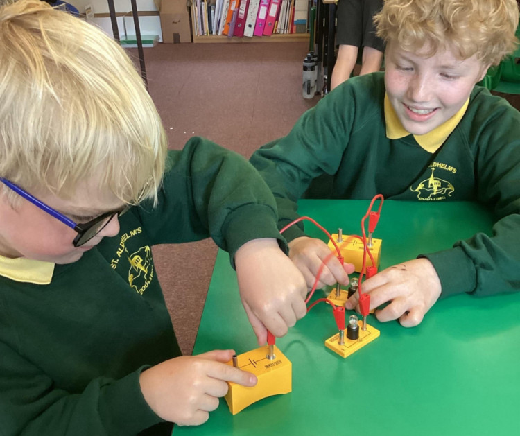 Primary school celebrates science award with Open Days for prospective parents.