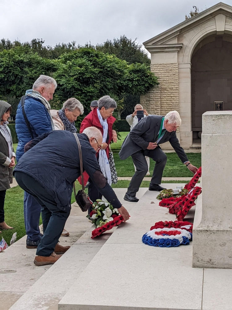 Dorchester Mayor Cllr Robin Potter lays a wreath at the Bayeux war cemetery.