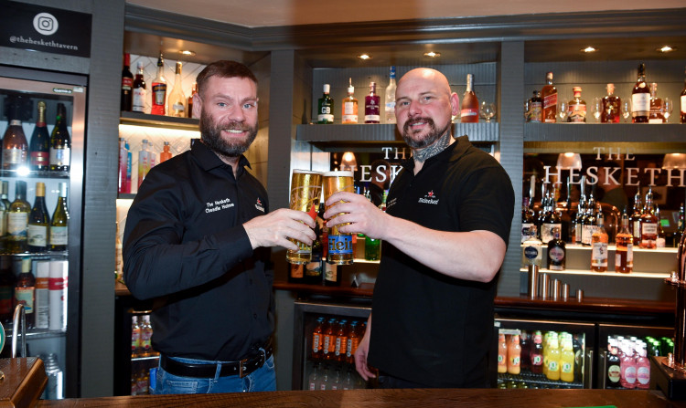 New publicans, Pawel Galazka and Rafal Zejmo, pose behind the bar of The Hesketh in Cheadle Hulme, newly re-opened as of 3 October (Images - Star Pubs)