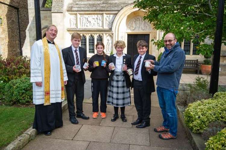 Father Tim and Vyv from Rutland Foodbank with some of the food