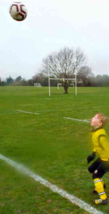 Ellis Humphrey keeps his eyes on the ball despite the rain