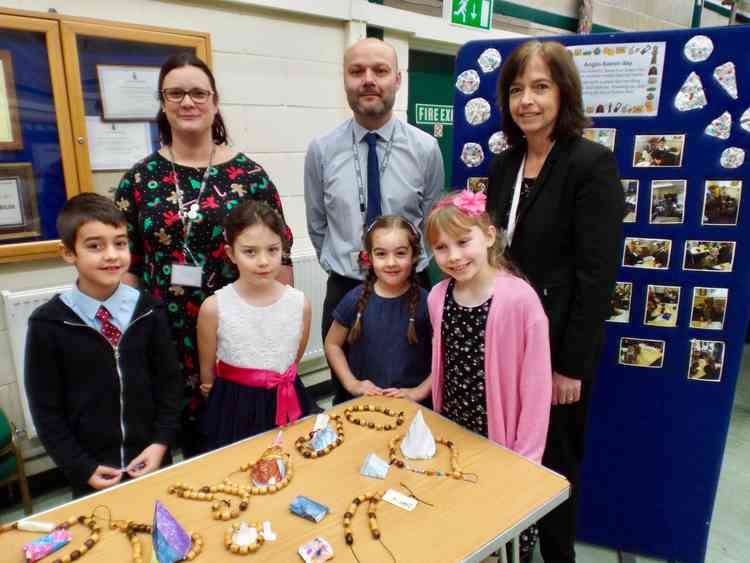 Shotley Community Primary School head teacher Richard Dedicoat with Asset Education chief executive Claire Flintoff (right) and pupils at an Anglo Saxon day