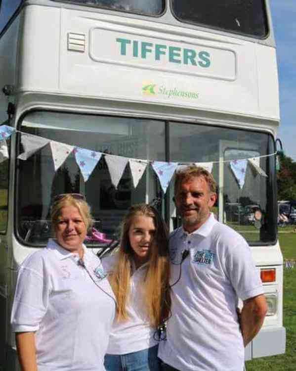 Gareth Brenland with Tiffers offering their mini-bus