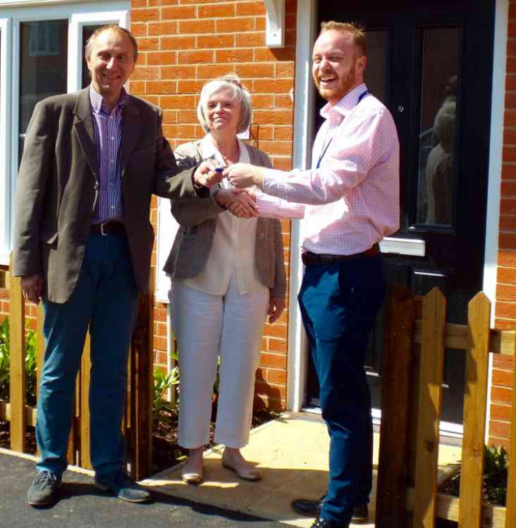 Babergh cabinet member Jan Osborne with keys to a house