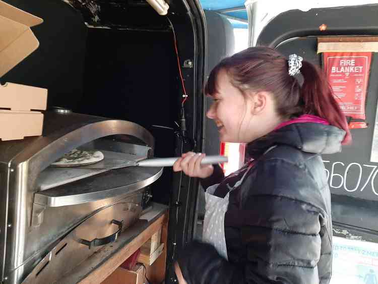 Freya Ewart making pizza