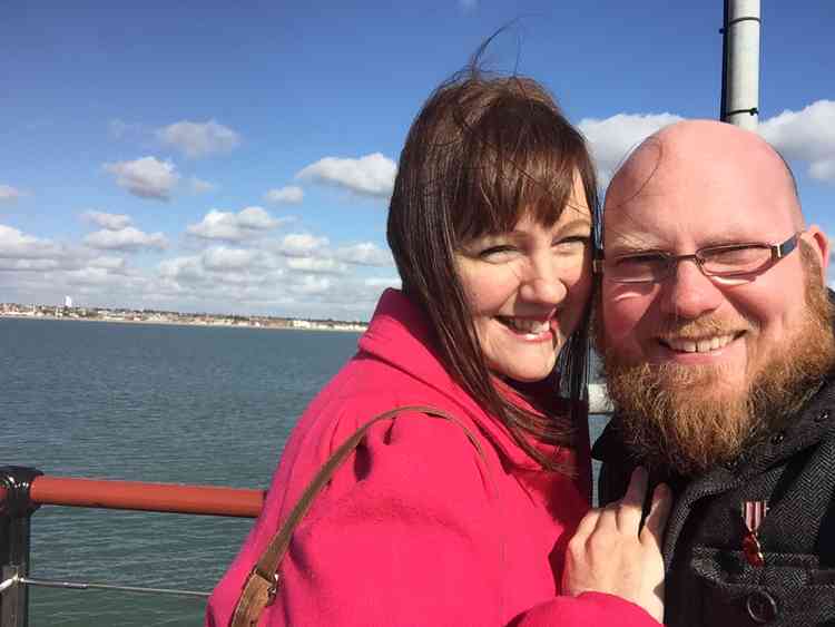 Tim Buckle has been helping community groups distribute food parcels, seen here with wife Amy who has been working with an outreach group