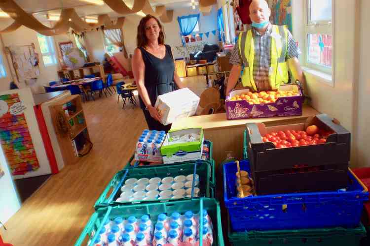 Theresa Butcher and Rob Billing with food from Fare Share