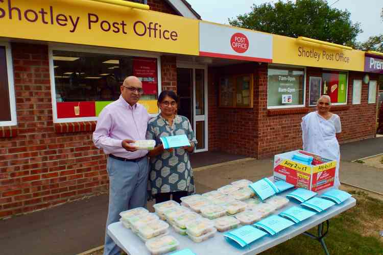 Postmaster Manish Patel with his mother Kokila and wife Trupti with their thank you gifts