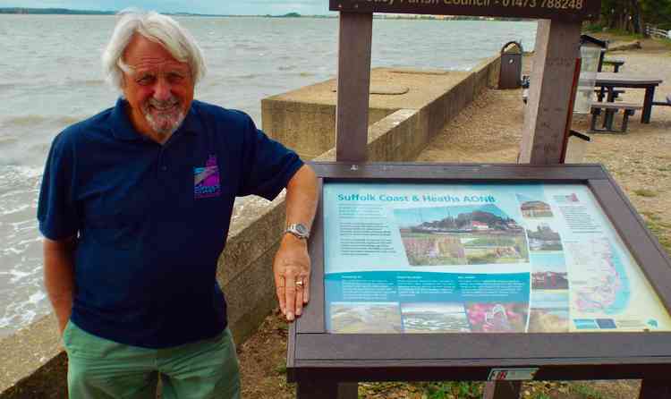 David Wood at AONB information board with extension area in the background