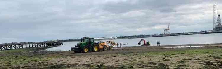 A tractor tried unsuccessfully to rescue the digger Thursday afternoon (Contributed)