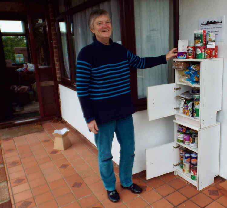 Alan Baxter with the Little Free Pantry in Shotley Gate (next to the wooden snowman)