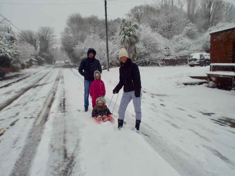 Dale and Sam Weeding enjoying family sledging