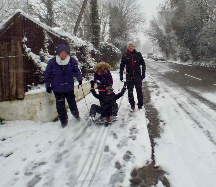 Andy, Jane, Poppy and Ellis Humphreys with sled