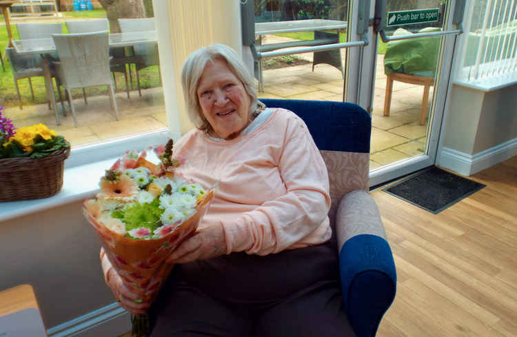 Rosemary with her bouquet of flowers for Mothers Day