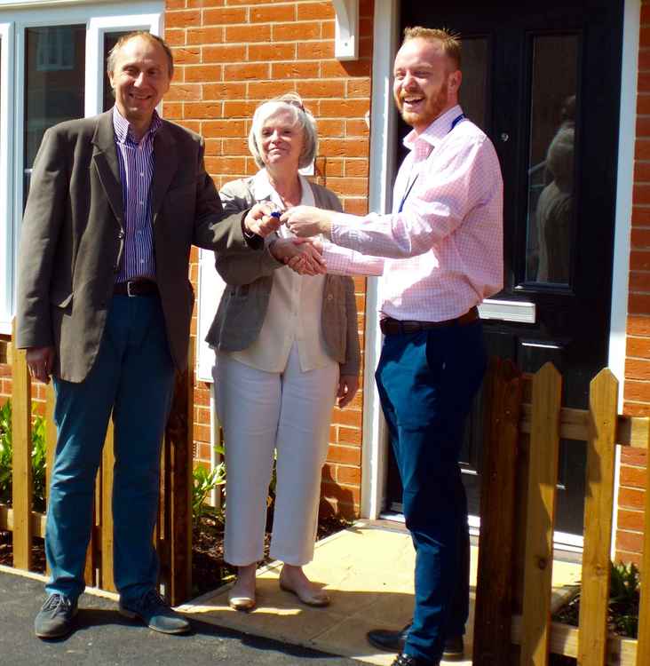Leader John Ward with new homes for Babergh residents in Holbrook