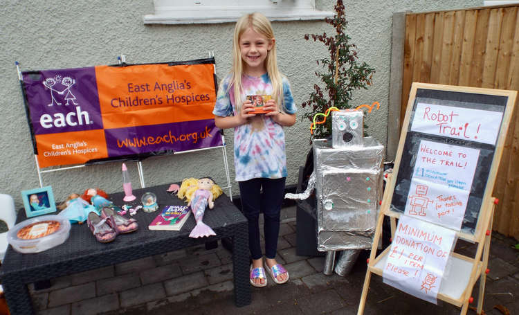 Evie Rawlings with her robot raising money for East Anglia's Children's Hospice