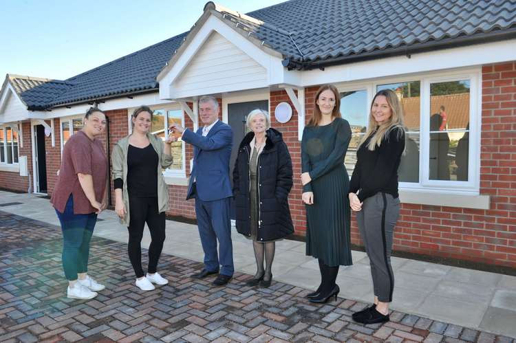 Shotley residents Krystle and Zoe with keys to new homes along with ward councillor Derek Davis and Babergh cabinet member for housing Cllr Jan Osborne, along with Sarah Evans of DCH Construction Ltd (Picture credit: Lucy Taylor)