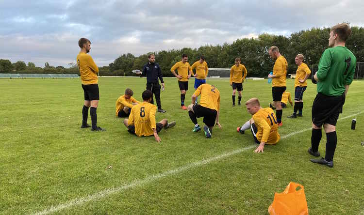 Manager Eamonn Richards leads a half time team talk