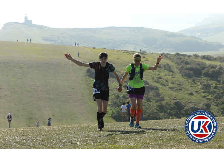 Sam and Mary pictured at the top of the Seven Sisters climb (Image by Stuart March Photography / UKUltra)