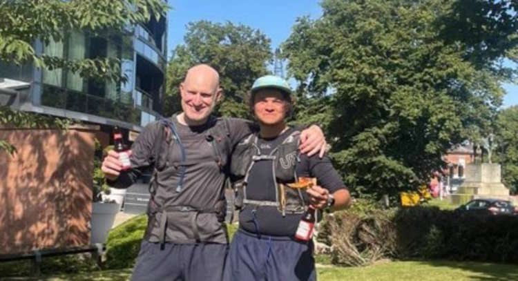 Crossing the line beer in hand, Andy (left) with fourth placed Joe; who he ran with on days five and six