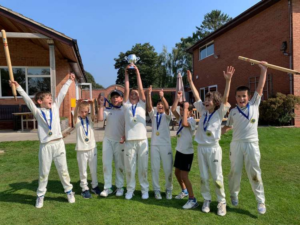 Captain Max Ashley lifts the Warwickshire Hardball League Championship trophy for KCC under Nines