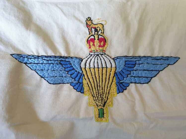 The Parachute Regiment badge embroidered by Cpl Johnston whist convalescing