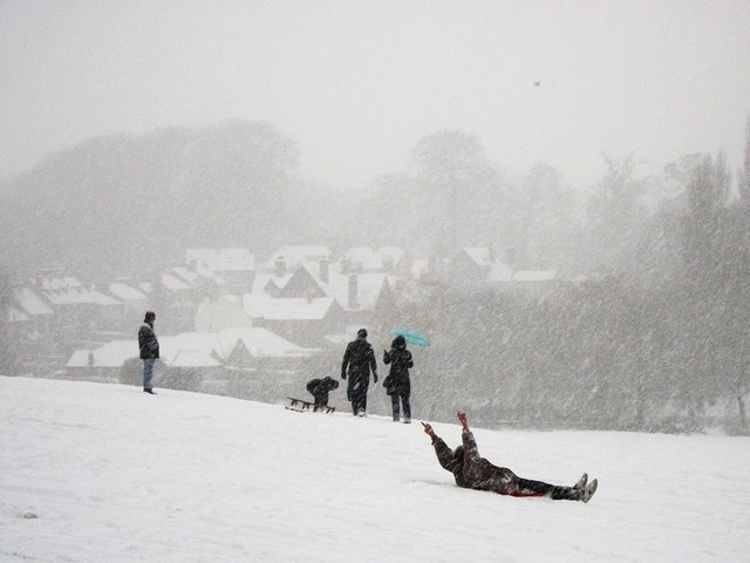 'Sledging in the snow, Abbey Fields' by John Brightley